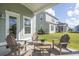 Covered patio with wood furniture and a view of the backyard at 109 Orchard Blossom Ln, Summerville, SC 29485