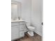 Well lit bathroom features a neutral color palette, hardwood flooring, and a toilet and vanity at 114 Battle Boat Blvd, Summerville, SC 29485