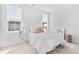 Sun-filled bedroom showcasing a plush bed, stylish bedside tables, and bright, airy atmosphere at 114 Battle Boat Blvd, Summerville, SC 29485