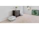 Comfortable bedroom featuring a dresser, cozy poufs, and a peaceful, inviting atmosphere at 114 Battle Boat Blvd, Summerville, SC 29485