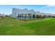 Spacious backyard featuring a manicured lawn and a secure black metal fence at 123 Leeward Lndg, Summerville, SC 29486