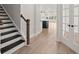 Inviting entryway showcases hardwood flooring, an open staircase, and bright, airy ambiance at 123 Leeward Lndg, Summerville, SC 29486
