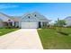 Attractive single-Gathering home with a two-car garage, well-kept lawn, and inviting curb appeal at 123 Leeward Lndg, Summerville, SC 29486
