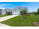 Beautiful single-Gathering home with a two-car garage, manicured lawn, and mature landscaping at 123 Leeward Lndg, Summerville, SC 29486