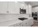 Bright kitchen features white subway tile and countertop with stainless steel appliances at 123 Leeward Lndg, Summerville, SC 29486