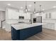 Bright kitchen features a large blue island with white countertops and stainless steel appliances at 123 Leeward Lndg, Summerville, SC 29486