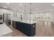 Bright kitchen features a large island with stainless steel appliances and an open floor plan at 123 Leeward Lndg, Summerville, SC 29486