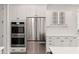 Bright kitchen features stainless steel appliances and white cabinets at 123 Leeward Lndg, Summerville, SC 29486