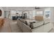 Open concept living room and kitchen features a large island with seating and hardwood floors at 123 Leeward Lndg, Summerville, SC 29486