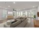 Bright, open living room with hardwood floors, recessed lighting, and multiple seating areas at 123 Leeward Lndg, Summerville, SC 29486