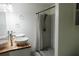 Modern bathroom featuring double sinks, granite countertops, and a tiled walk-in shower at 124 Brush Blvd, Goose Creek, SC 29445