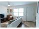 Bright living room featuring a comfortable couch, leather chair, and plenty of natural light at 124 Brush Blvd, Goose Creek, SC 29445
