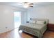 Inviting bedroom featuring wood floors, neutral decor, and a private balcony overlooking the outdoors at 124 Brush Blvd, Goose Creek, SC 29445