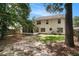A spacious backyard featuring mature trees, partial privacy fence, and a screened-in porch at 133 Guildford Dr, Goose Creek, SC 29445