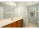Bathroom features a long vanity, a large mirror, and a shower at 133 Guildford Dr, Goose Creek, SC 29445
