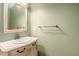 This bathroom features a vanity sink, a large mirror, and neutral paint at 133 Guildford Dr, Goose Creek, SC 29445