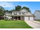 Charming two-story home with a covered front porch and a two-car garage at 133 Guildford Dr, Goose Creek, SC 29445