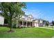 Beautiful two-story home with a well-manicured lawn and a covered front porch at 133 Guildford Dr, Goose Creek, SC 29445