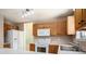 Well-lit kitchen featuring classic wood cabinetry and essential appliances at 133 Guildford Dr, Goose Creek, SC 29445