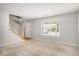 Bright living room featuring neutral carpet, a window, and a staircase at 133 Guildford Dr, Goose Creek, SC 29445