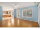 Bright living room features wood floors, and an open view of the kitchen area at 133 Guildford Dr, Goose Creek, SC 29445