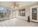 Sun room features an abundance of natural light, tile floors, and a ceiling fan at 133 Guildford Dr, Goose Creek, SC 29445