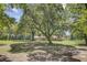 Expansive backyard with mature trees, a home, and outdoor seating area at 138 Brant Acres Ln, Bonneau, SC 29431