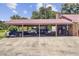 Large covered outdoor living space with entertainment options, hot tub and backyard views at 138 Brant Acres Ln, Bonneau, SC 29431