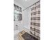 This updated bathroom features a shower/tub combo with stylish subway tile and modern fixtures at 138 Brant Acres Ln, Bonneau, SC 29431
