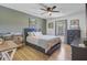 Comfortable bedroom features natural light, neutral decor, and wood-look floors at 138 Brant Acres Ln, Bonneau, SC 29431