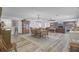 Open-concept dining area with a large table and views into the living room at 138 Brant Acres Ln, Bonneau, SC 29431