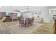 Dining area with wood floors and a view into the cozy living room at 138 Brant Acres Ln, Bonneau, SC 29431