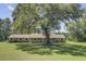 Ranch-style home on a spacious lot with large shade tree at 138 Brant Acres Ln, Bonneau, SC 29431