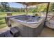 Inviting hot tub with steps, perfect for relaxation in a private outdoor setting at 138 Brant Acres Ln, Bonneau, SC 29431
