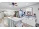 Bright kitchen boasts stainless appliances, large island, and views to the dining area at 138 Brant Acres Ln, Bonneau, SC 29431