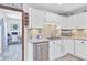 Well-lit kitchen featuring ample white cabinetry, stainless appliances, and modern fixtures at 138 Brant Acres Ln, Bonneau, SC 29431