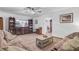 Cozy living room featuring comfortable seating, a TV, and a coffee table, perfect for relaxation and entertainment at 138 Brant Acres Ln, Bonneau, SC 29431
