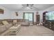Comfortable living room with large sectional sofa, ceiling fan, and built in display cabinet at 138 Brant Acres Ln, Bonneau, SC 29431