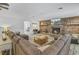 Comfortable living room showcases a brick fireplace, and wood floors at 138 Brant Acres Ln, Bonneau, SC 29431
