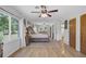 Light-filled main bedroom features hardwood floors, natural light, and sitting area at 138 Brant Acres Ln, Bonneau, SC 29431
