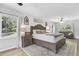 Spacious main bedroom featuring hardwood floors, natural light, and cozy sitting area at 138 Brant Acres Ln, Bonneau, SC 29431