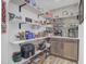 Well-organized pantry with open shelving and ample storage space for all your essentials at 138 Brant Acres Ln, Bonneau, SC 29431