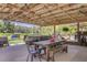 Spacious covered patio with dining and relaxation areas, great for outdoor gatherings at 138 Brant Acres Ln, Bonneau, SC 29431