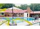 Backyard pool area with lounge chairs and outdoor bar, perfect for entertaining at 138 Brant Acres Ln, Bonneau, SC 29431