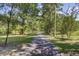 Tree-lined walking path creates a shaded outdoor space at 138 Brant Acres Ln, Bonneau, SC 29431