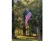 American Flag in wooded yard at 138 Brant Acres Ln, Bonneau, SC 29431