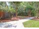A community backyard with sidewalks, mature trees, and maintained lawns at 1604 Basildon Rd, Mount Pleasant, SC 29466
