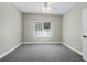 A comfortable carpeted bedroom featuring one window for natural light at 1604 Basildon Rd, Mount Pleasant, SC 29466