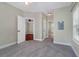 Neutral bedroom with a ceiling fan and three doorways, all featuring light paint at 1604 Basildon Rd, Mount Pleasant, SC 29466