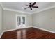 Cozy bedroom with hardwood floors and a view of the outdoors from the balcony at 1604 Basildon Rd, Mount Pleasant, SC 29466